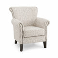 Sillón tapizado de tela beige con diseño decorativo